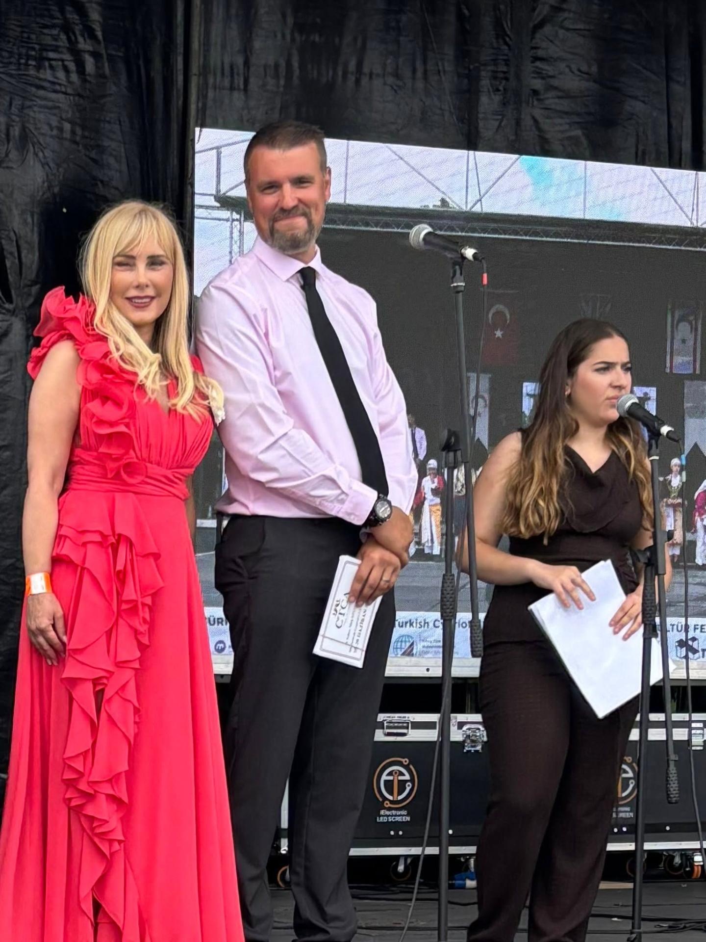 Hosts on stage at the Turkish Cypriot Cultural Festival